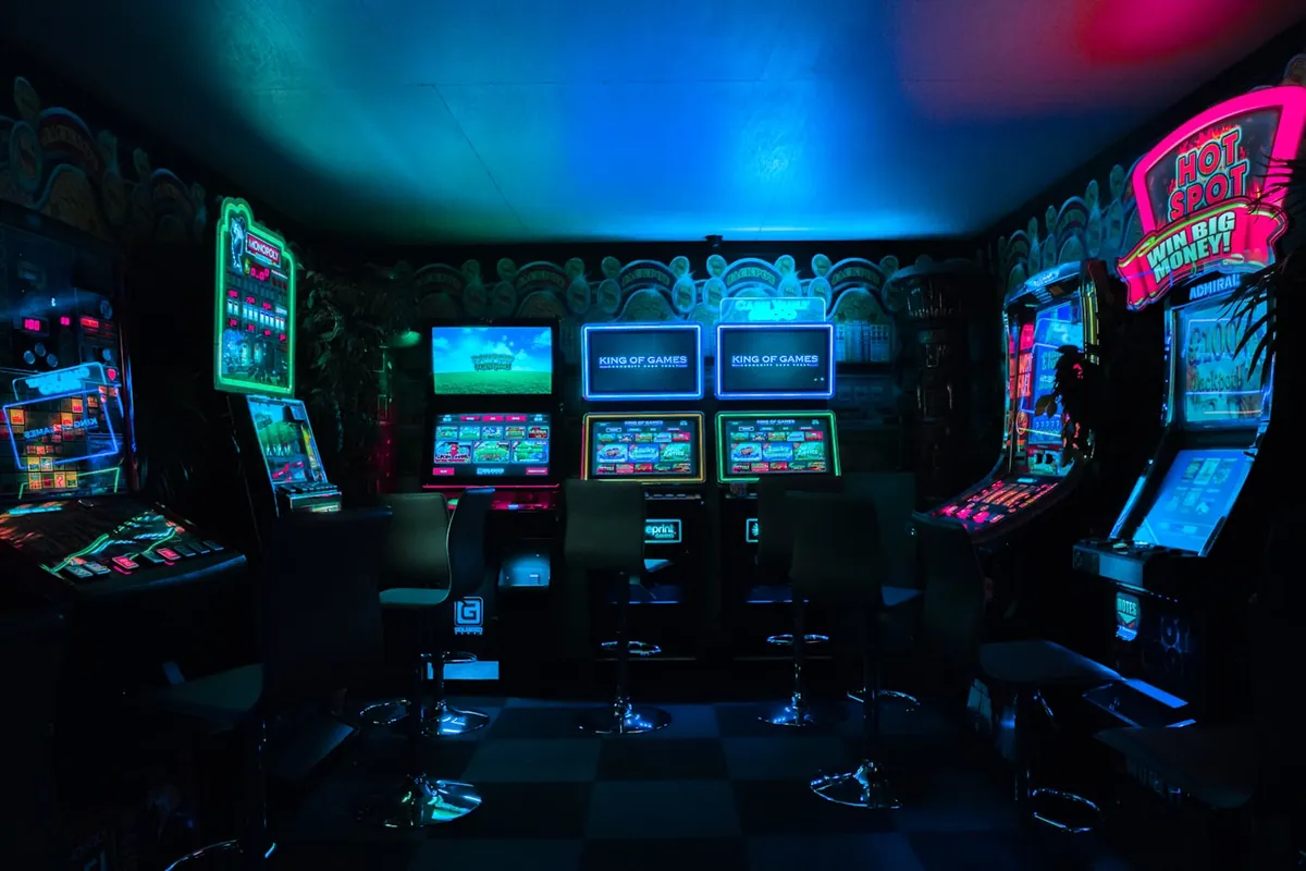 Arcade games lit up inside an entertainment venue