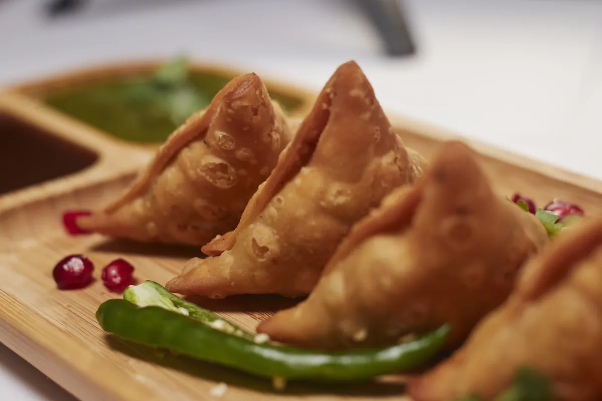 Fresh samosas plated at a local kitchen